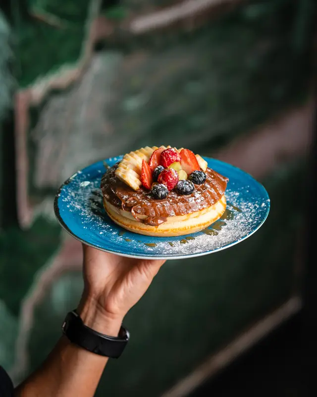 A Nutella pancake carried to the table